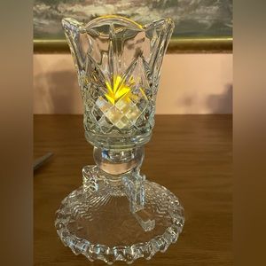 Diamond cut peg votive holder with base.